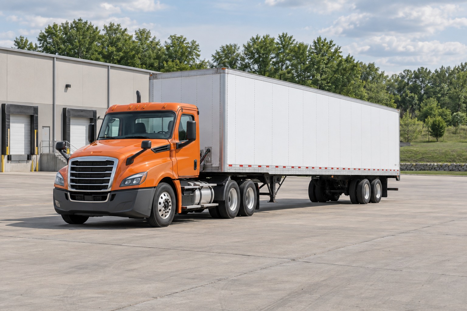 Illustrative orange tractor and white trailer parked in a tree-lined freight yard